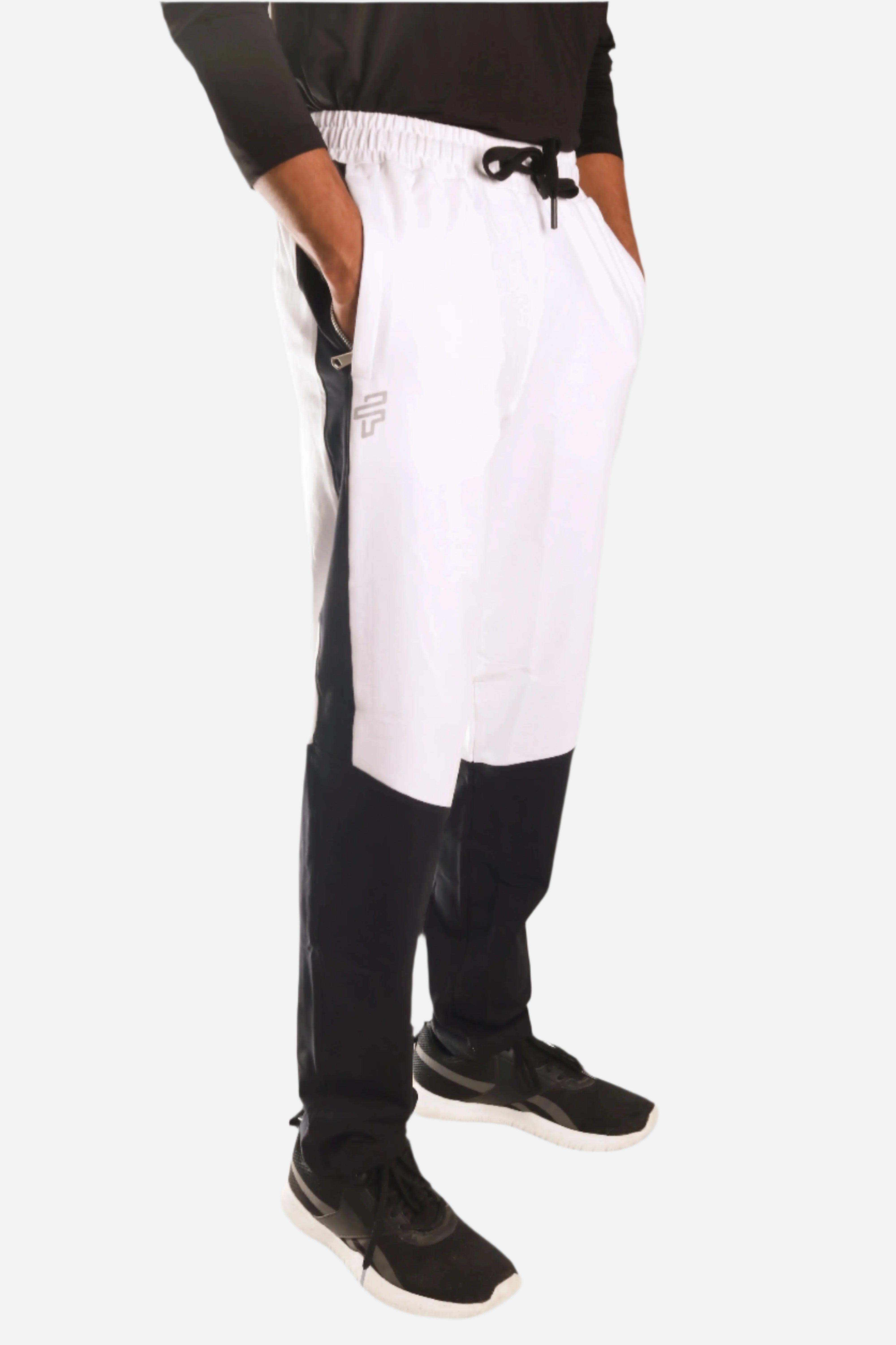 Flecto DuoFlex bottoms in black and white designed for flexible movement and everyday comfort